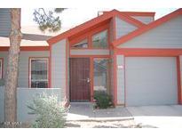 Charming home exterior with red trim and a well-maintained front yard at 14002 N 49Th Ave # 1021, Glendale, AZ 85306