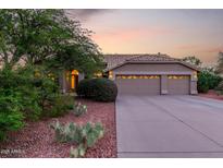 Charming single-story home featuring a three-car garage and desert landscaping at 29670 N 46Th St, Cave Creek, AZ 85331