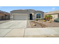 Charming single-story home featuring low-maintenance desert landscaping and a two car garage at 13529 W Remuda Dr, Peoria, AZ 85383