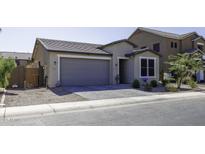 Charming single-Gathering home with well-maintained landscaping, a gray roof, and a two-car garage at 1972 N Hubbard Ln, Casa Grande, AZ 85122