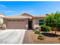 Charming single-story home with a well-maintained front yard and two car garage at 45424 W Norris Rd, Maricopa, AZ 85139