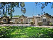 Inviting single story exterior featuring desert landscaping and an adorable covered entryway at 6711 W Osborn Rd # 82, Phoenix, AZ 85033