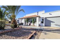 Charming single-story home with a landscaped yard, desert plants, and a covered front porch at 6722 E Jean Dr, Scottsdale, AZ 85254