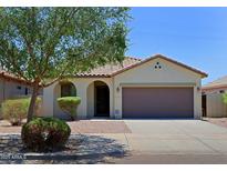 Charming single-story home with a tile roof, arched entryway, and a well-maintained front yard with mature landscaping at 2333 W Alta Vista Rd, Phoenix, AZ 85041