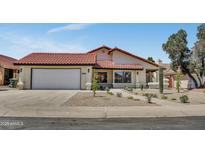 Charming single-story home featuring a well-maintained desert landscape and a red tile roof at 3926 E Coconino St, Phoenix, AZ 85044
