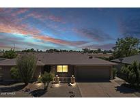 Charming single-story home with mature landscaping and a two-car garage in a quiet neighborhood at 4117 E Carol Ave, Mesa, AZ 85206
