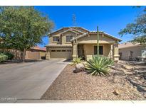 Charming two-story home with desert landscaping and a well-maintained front yard at 708 E Dry Creek Rd, San Tan Valley, AZ 85143
