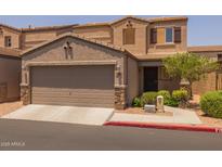 Inviting two-story home featuring an attached two-car garage and well-maintained landscaping at 2565 E Southern Ave # 83, Mesa, AZ 85204