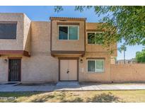 Charming townhouse featuring a neutral color scheme, a private front entrance, and well-maintained landscaping at 4268 N 68Th Ave, Phoenix, AZ 85033