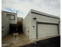 A well-maintained two-story house with an attached garage featuring desert landscaping and block wall construction at 4729 W Eva St, Glendale, AZ 85302