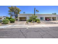 Charming single-level home with a well-maintained front yard and carport, creating a welcoming curb appeal at 5335 N 78Th St, Scottsdale, AZ 85250