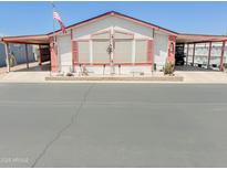 Charming single-story home featuring a covered carport, landscaped front yard, and decorative exterior details at 5735 E Mcdowell Rd # 436, Mesa, AZ 85215