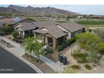 Beautiful single-story home with tile roof, desert landscaping, and mountain views at 20702 W Hillcrest Blvd, Buckeye, AZ 85396