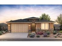 Charming single-story home featuring a 2-car garage, beautiful stone accents, and desert landscaping at 13518 W Copperleaf Ln, Peoria, AZ 85383