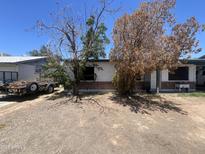 Modest single story home with a brick foundation and desert landscaping at 3440 W Bluefield Ave, Phoenix, AZ 85053