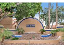 Beautiful landscaped entrance to Las Hadas community with tiled accents at 5640 E Bell Rd # 1099, Scottsdale, AZ 85254