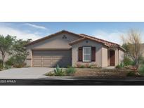 Charming single-story home with a two-car garage and a desert-landscaped front yard at 2731 W La Mirada Dr, Laveen, AZ 85339