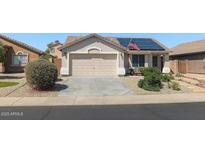 Charming single-Gathering home with a two-car garage, solar panels, and low-maintenance desert landscaping at 43328 W Chisholm Dr, Maricopa, AZ 85138