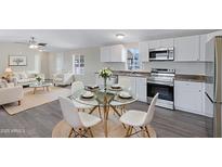 Bright living space boasts a modern kitchen, dining area, and comfortable seating with natural light and stylish decor at 320 E Mckellips Rd # 204, Mesa, AZ 85201