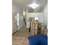 Open-concept living room featuring tile floors and bright lighting at 3324 W Mcrae Way # 2, Phoenix, AZ 85027