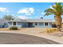 Charming single-story home featuring a well-maintained yard and inviting curb appeal at 4829 E Apache Cir, Phoenix, AZ 85044