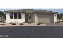 Charming single-story home with a two-car garage, neutral stucco, and well-maintained desert landscaping at 5610 W Hopi Trl, Laveen, AZ 85339