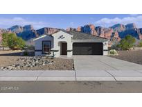 Charming single-story home featuring a modern gray roof and a two-car garage at 2515 S 125Th Dr, Avondale, AZ 85323