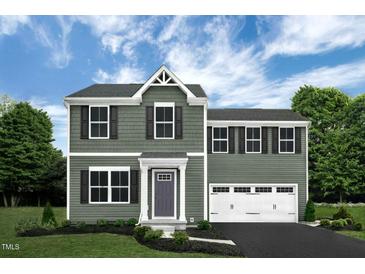 Two-story house with gray siding, white trim, and a two-car garage at 137 Tormore Dr, Sanford, NC 27330