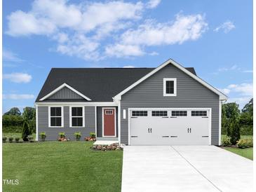 Charming gray home featuring a well-manicured lawn and a two-car garage at 356 N Coral Bells Way Way, Four Oaks, NC 27524