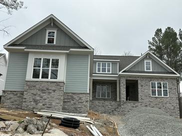 Craftsman style home with stone and gray siding at 95 Colonial Trail Ct, Pittsboro, NC 27312