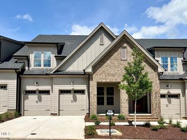Charming brick-and-siding home with a well-manicured lawn and two-car garage in a desirable neighborhood at 804 Ambercrest Place, Durham, NC 27705