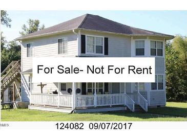 Two-story home featuring a covered porch and exterior staircase access to the second floor at 2913 Wadsworth Ave, Durham, NC 27707