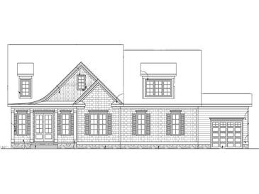 Exterior elevation of a home with shingle siding, symmetrically placed windows, and an attached garage at 5308 Parkwood Dr, Raleigh, NC 27612
