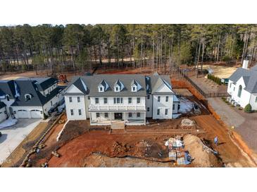 Stunning exterior elevation of a new construction home with a gray roof and covered front porch at 4813 Parker Meadow Dr, Raleigh, NC 27614