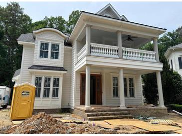 An in-progress exterior elevation of a home featuring a double porch with columns and detailed trim at 8305 Society Pl, Raleigh, NC 27615