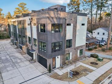 Modern townhouses with rooftop decks and private garages at 515 Edgecreek Ct, Raleigh, NC 27604