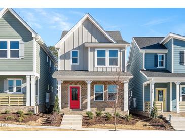 Two-story house with red door, gray siding, and brick accents at 912 Allen Park Dr, Raleigh, NC 27604