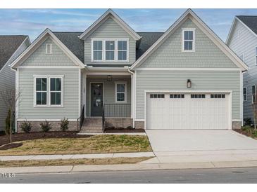 Two-story Craftsman home with gray siding, white trim, and a two-car garage at 205 Wash Hollow Dr, Wendell, NC 27591