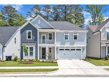 Charming two-story home with a welcoming front porch and attached two car garage at 9140 Dupree Meadow Dr # 9, Angier, NC 27501