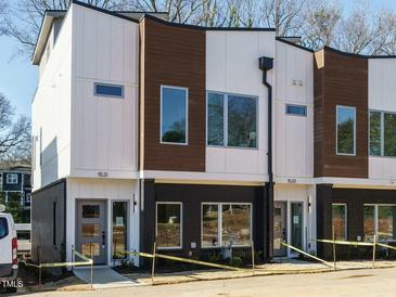 Modern three-unit townhome development with clean lines and a neutral color palette at 1531 Urban Trace Ln, Raleigh, NC 27608