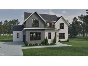 Striking exterior elevation with a mix of board and batten and white painted brick, complemented by black trim windows at 725 Catawba St, Raleigh, NC 27609