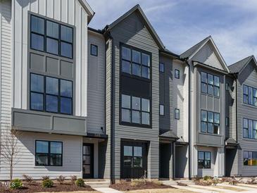 New construction townhomes with multiple windows and neutral color schemes at 1146 Cottonsprings Dr, Wendell, NC 27591