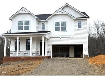 Two-story white house with a gray roof and brick foundation at 98 Claude Creek Dr, Smithfield, NC 27577