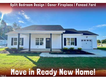 Move-in ready new home with split bedroom design, corner fireplace, and fenced yard at 36 Kevior Ave, Four Oaks, NC 27524