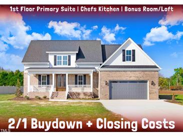 Brick home with gray garage door and front porch at 46 Otter Hole Dr, Princeton, NC 27569