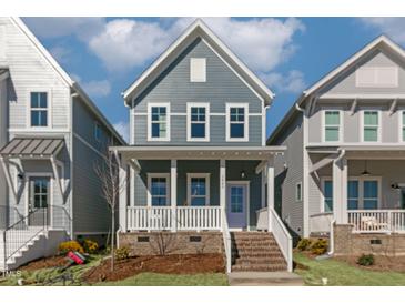 Charming two-story home with a welcoming front porch and well-manicured lawn, perfect for families at 1660 Piney Falls Dr, Wendell, NC 27591