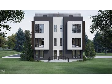 Modern townhome featuring sleek lines, large windows, and a beautifully landscaped front yard at 512 Gordon St # 1102, Durham, NC 27701