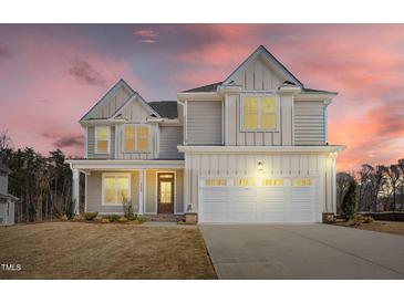 Beautiful two-story home featuring a two-car garage, covered porch, and lovely, neutral color palette at 1125 Brookfield Dr, Gibsonville, NC 27249