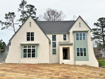 Beautiful new construction home featuring a painted brick facade and modern window trim detail at 217 Dublin Rd, Raleigh, NC 27609
