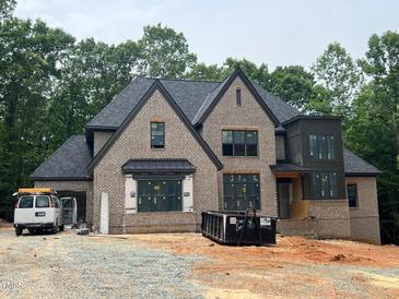 New brick home construction with black roof and modern design; lots of natural light and curb appeal at 67 Ridgeline Ct # 7, Pittsboro, NC 27312